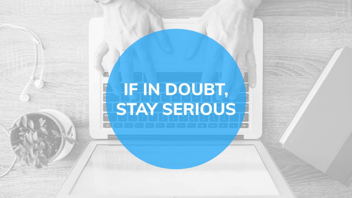 Gray presentation slide with message over blue circle "If in doubt, stay serious"